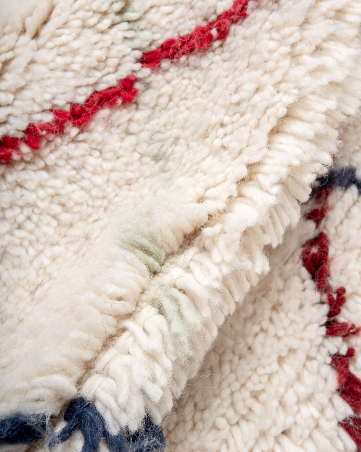 Modern, designer, handcrafted Berber rug from Morocco. Beniourain carpet with beautiful colours and patterns and fluffy wool texture.
